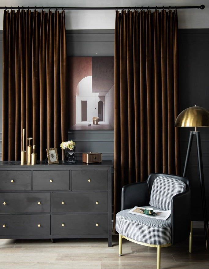 High-matte velvet drapes in dark brown, elegantly styled in a living room with vintage decor and modern furniture.