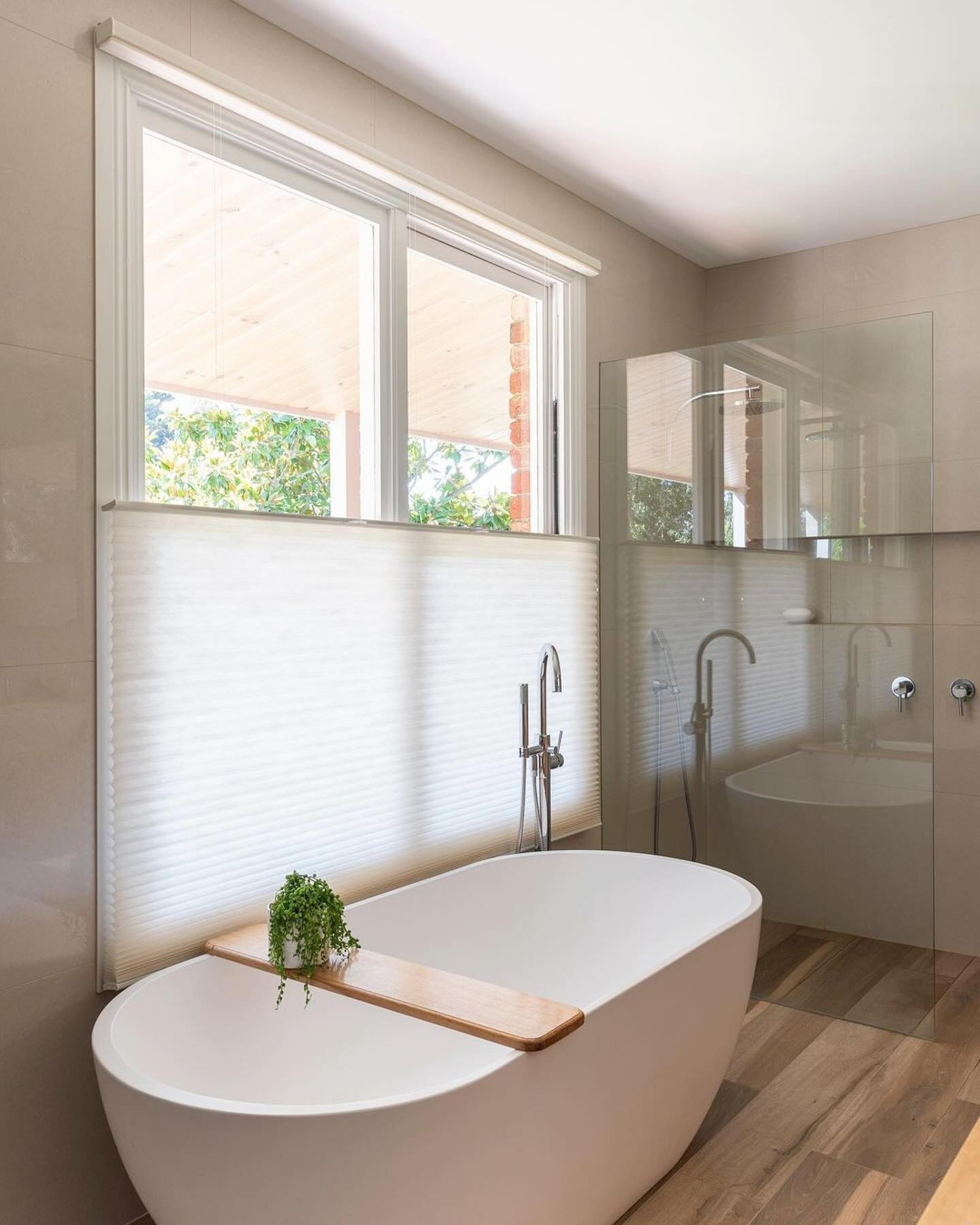 Cordless honeycomb blinds in bathroom, showcasing top down bottom up design.