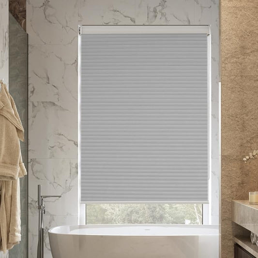 Waterproof bathroom blinds in a modern marble bathroom.
