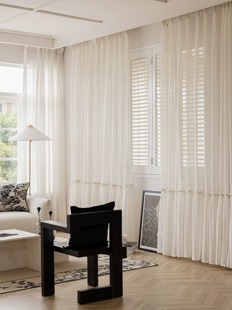 Ruffled hem cream sheer curtains in a princess-themed room with elegant decor.