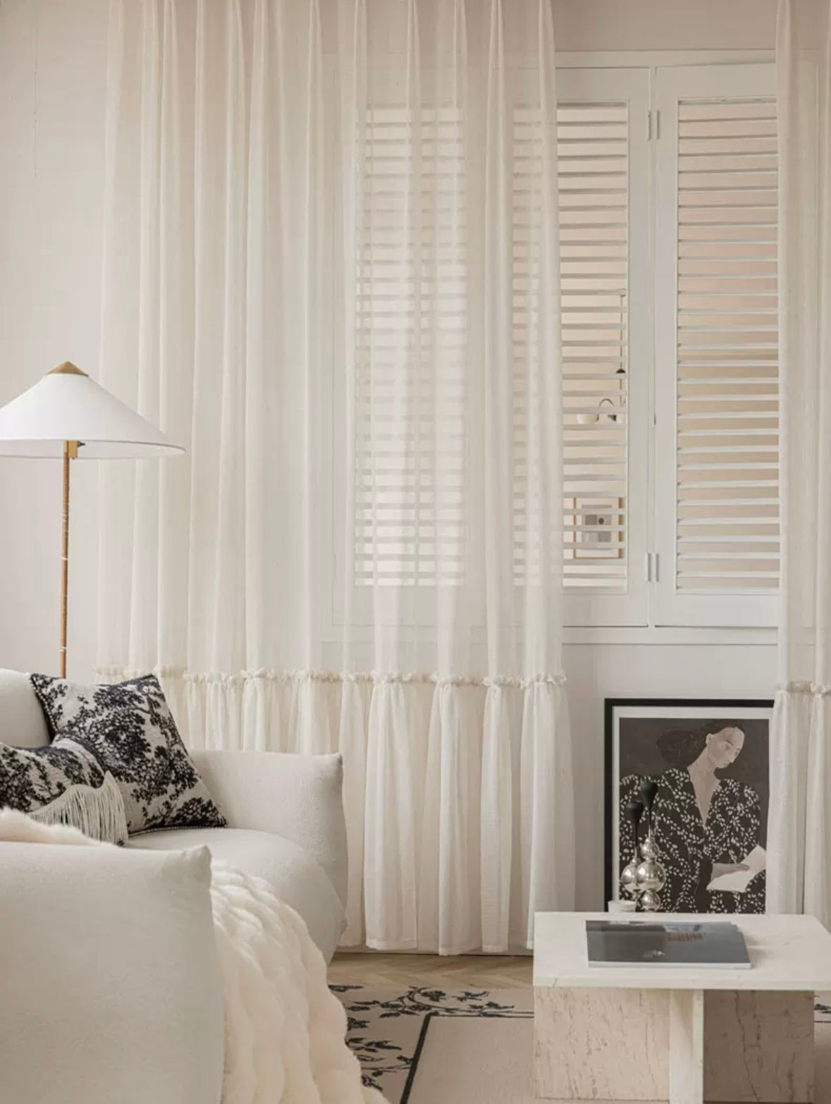 Ruffled hem cream sheer curtains in a princess-themed room.