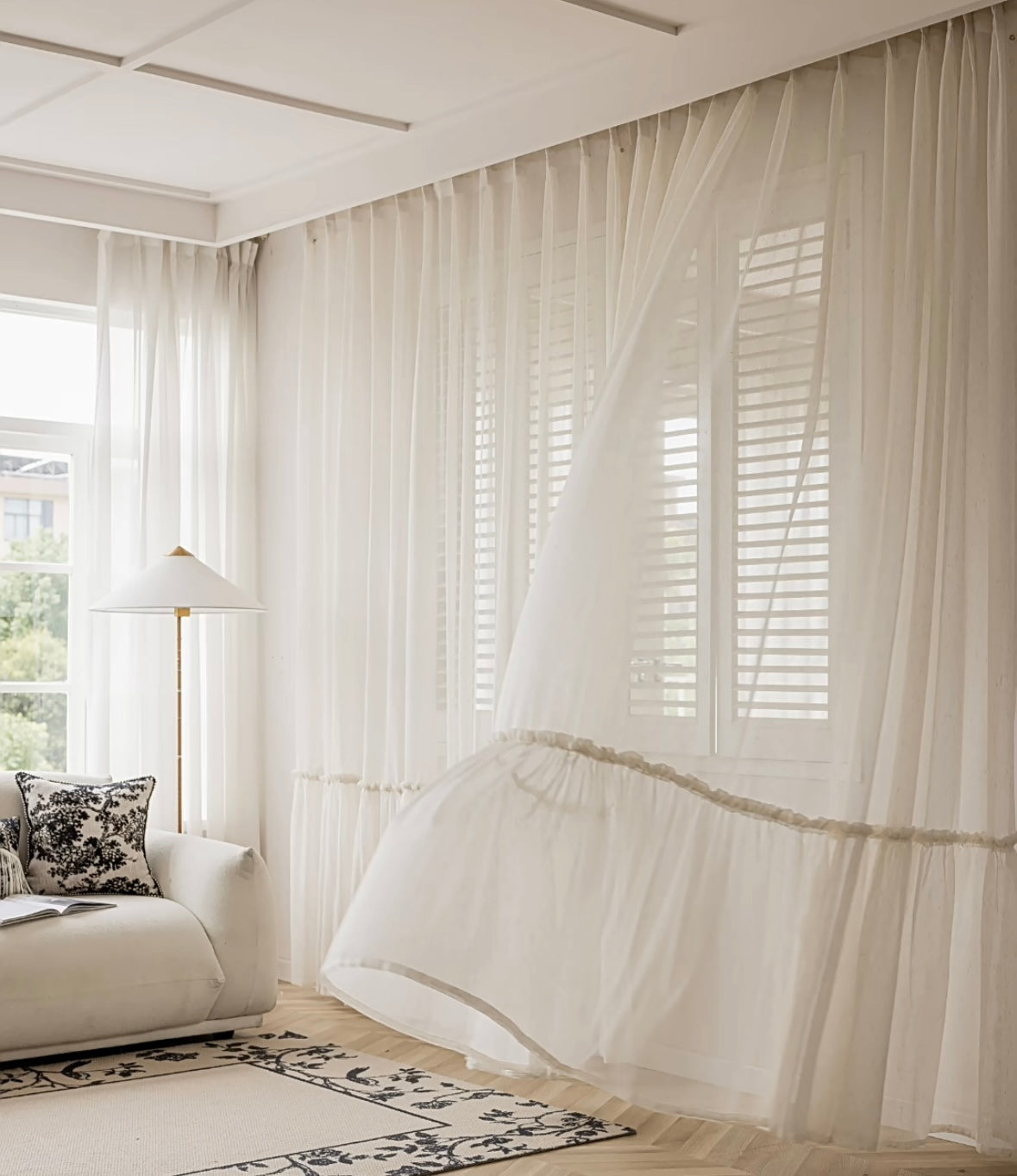 Ruffled hem cream sheer curtains in a princess-themed room with flowing design.