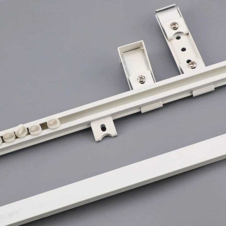 Ultra-thin aluminum ceiling curtain track with whisper-quiet operation and versatile installation.