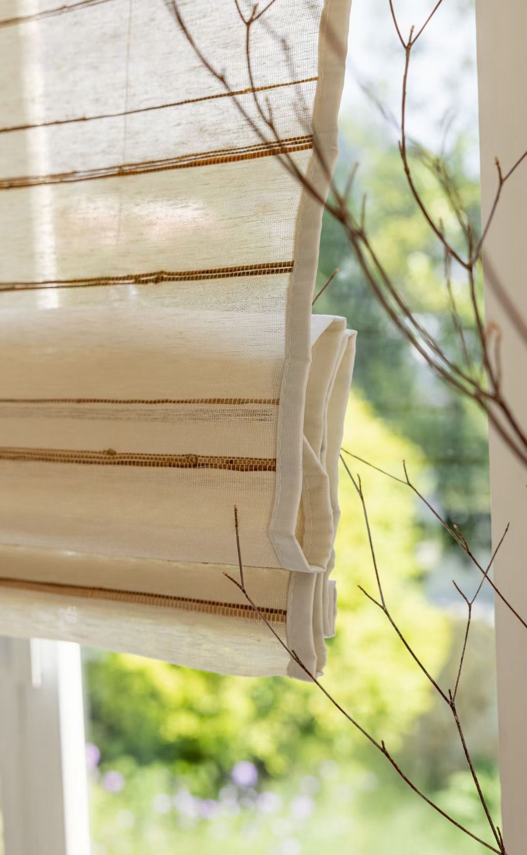 Natural bamboo shades made from eco-friendly ramie fabric with a textured, breathable, and handcrafted ivory sand finish