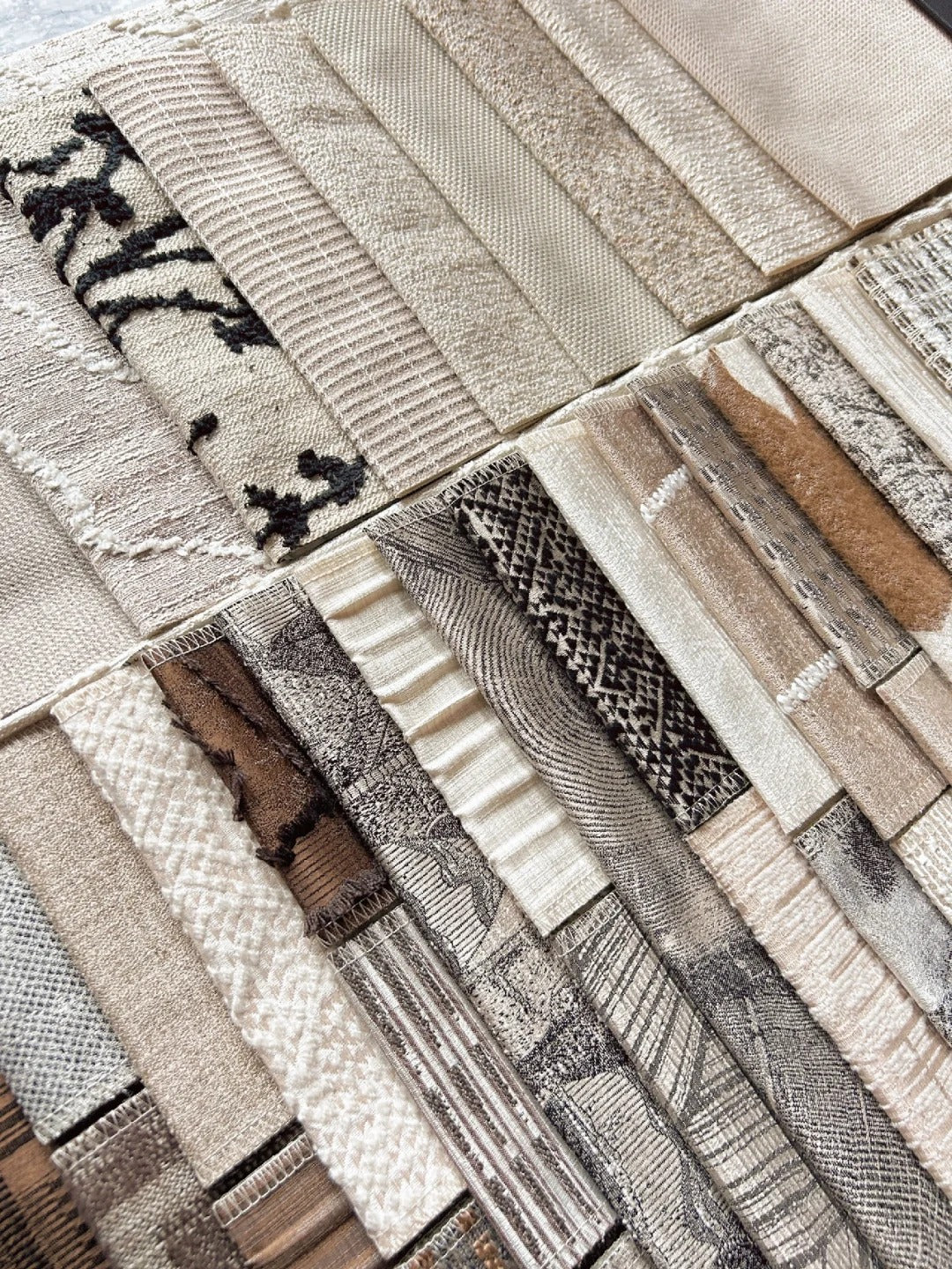 Variety of fabric swatches in neutral tones displayed for selection.