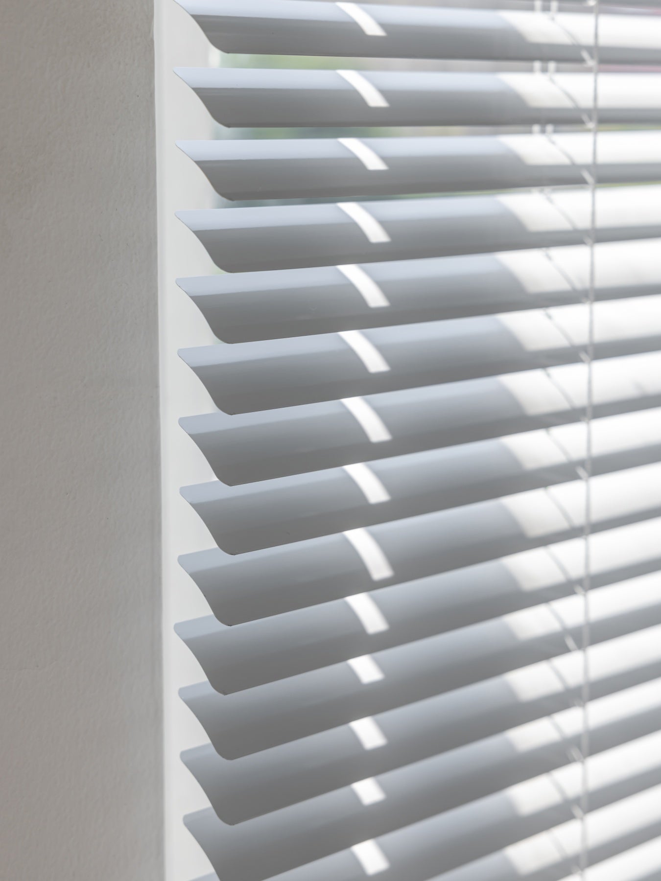 Durable vinyl blinds with water and oil-resistant aluminum slats, ideal for mini windows.