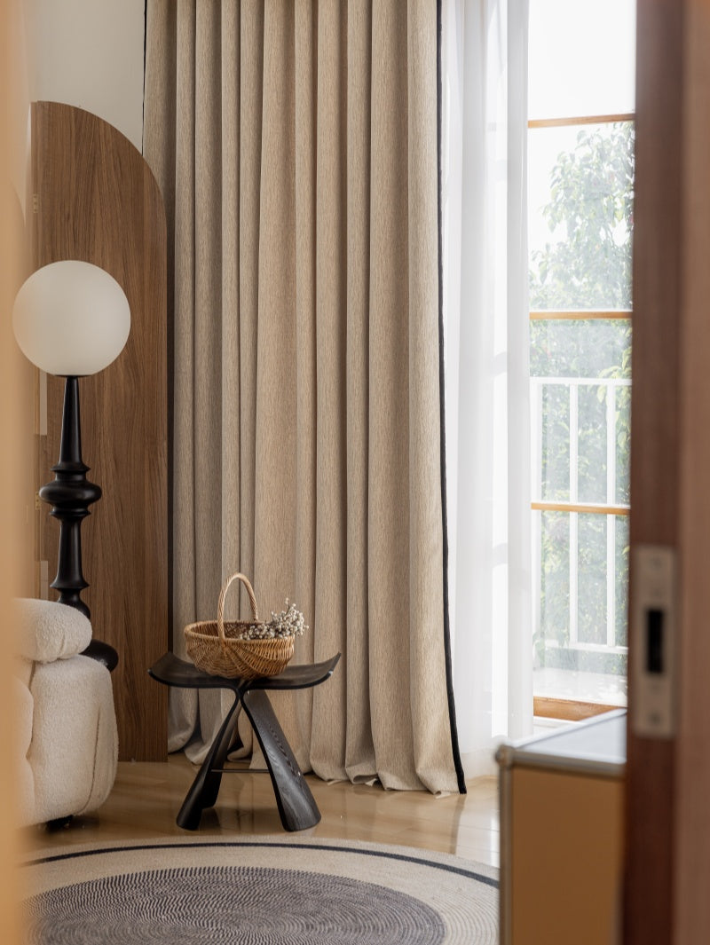 Custom curtains in beige chenille drapery for bedroom, blackout feature.