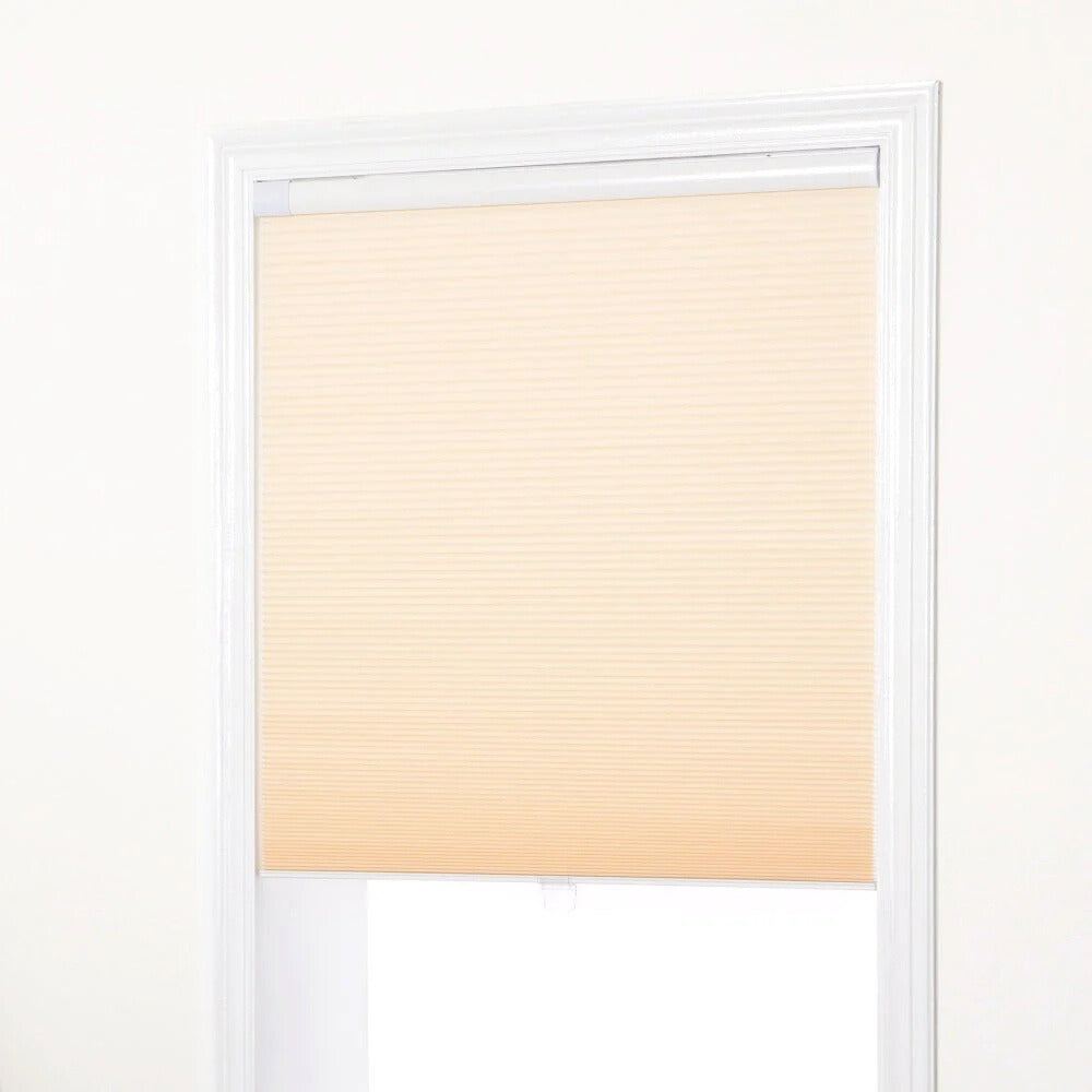 No-drill honeycomb shades in beige with tool-free, quick installation and cordless operation on window frame