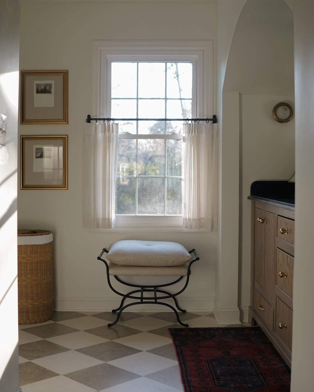 Custom cafe curtains in semi-sheer fabric hanging in a cozy kitchen space.