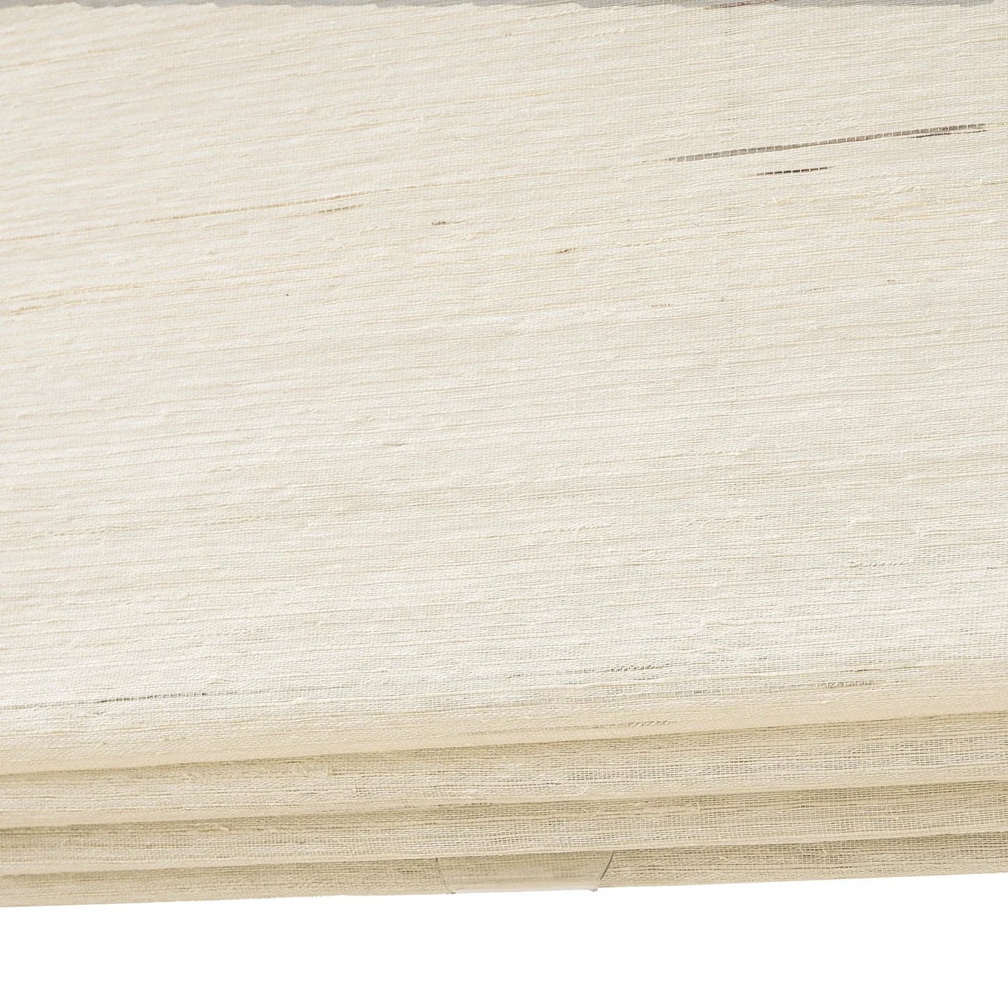 Coconut white natural ramie bamboo window shades with delicate woven texture.