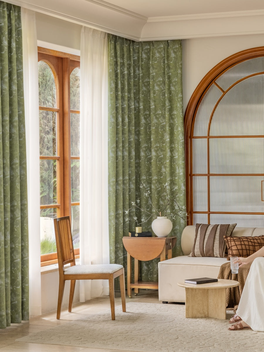 Green ginkgo leaf pattern jacquard blackout curtains in stylish living room setting.