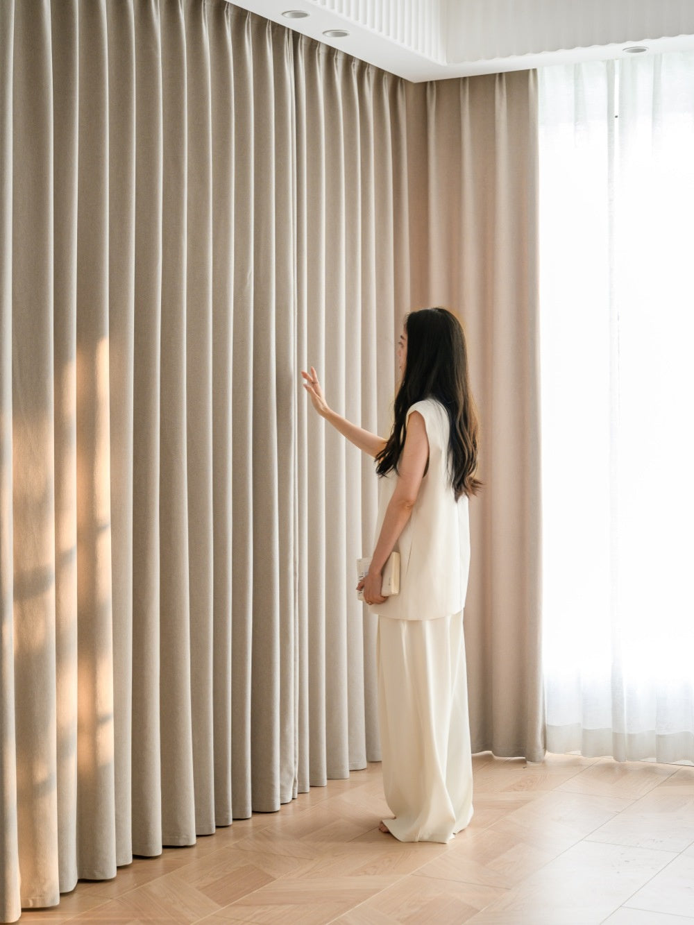 Luxury cashmere texture blackout curtains with pleats in a modern home setting.