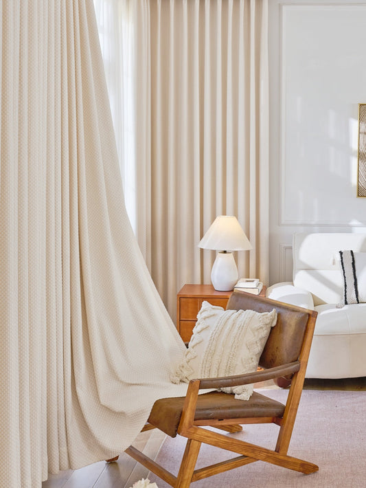 Thermal curtains "Pearl Drops" in elegant room setting, showcasing soundproof and heat-blocking design.
