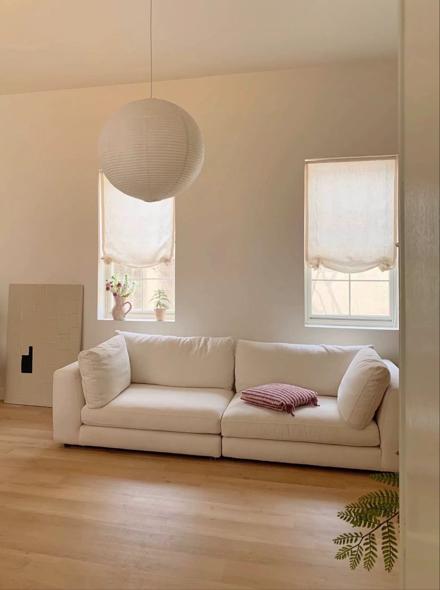 Custom relaxed Roman window shades in a light-filled room.