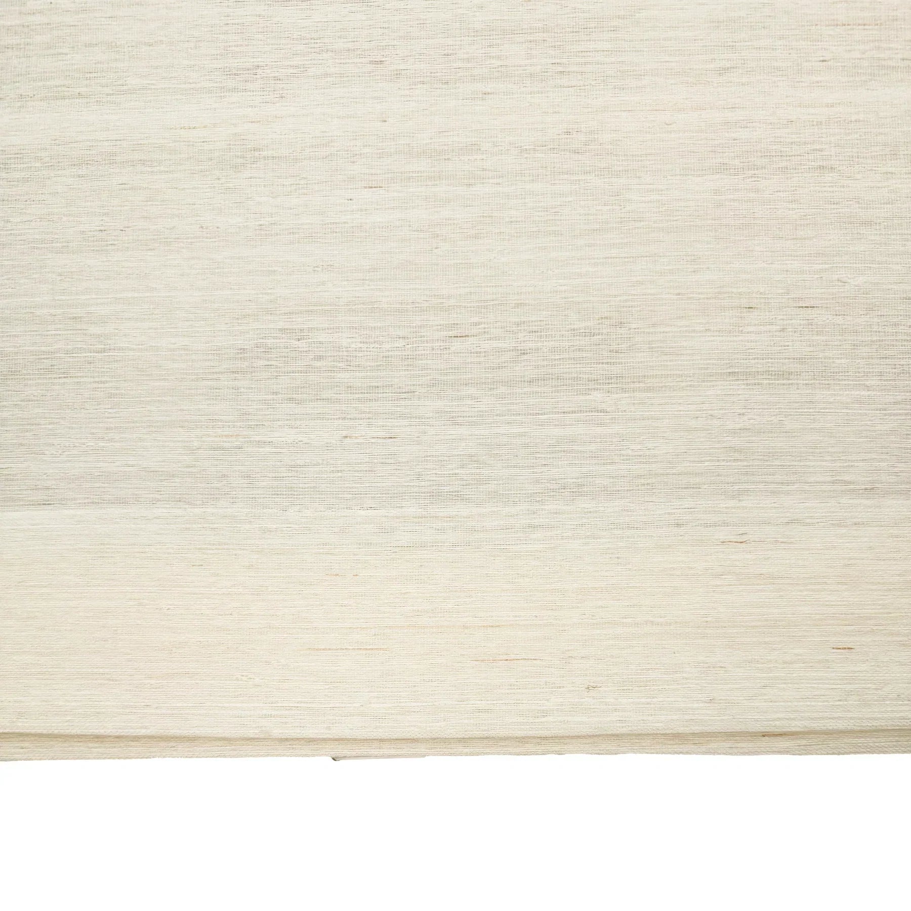Natural ramie bamboo window shades in coconut white, featuring a delicate and refined texture, ideal for light interiors.
