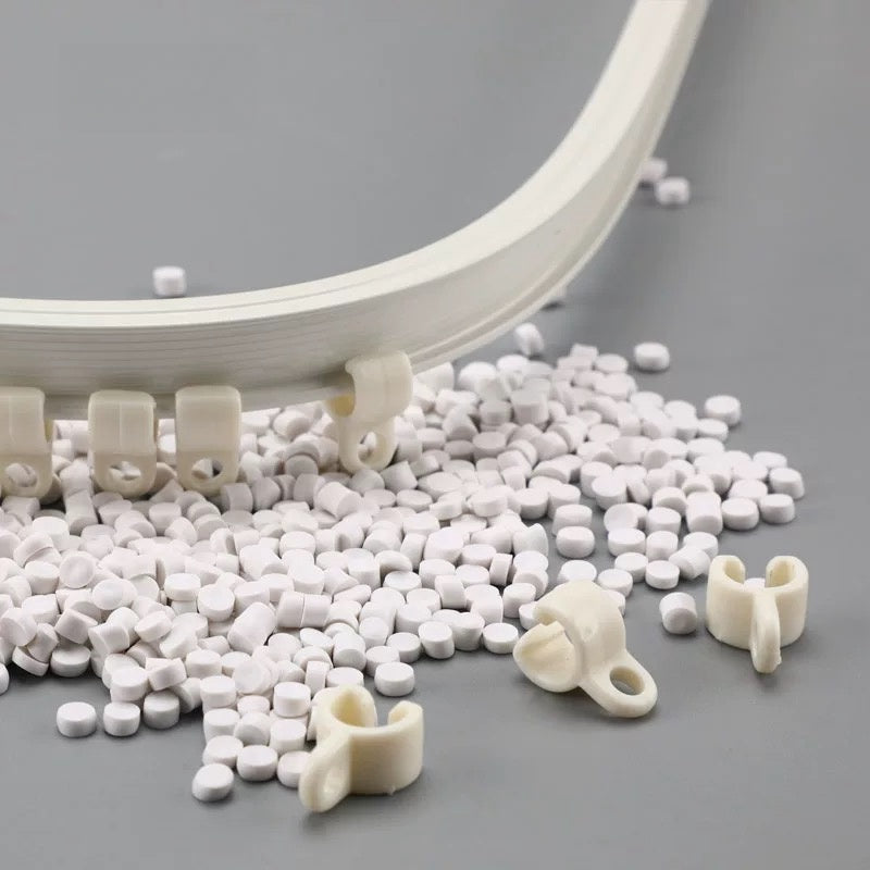 Ultra-thin curved track for bay windows with white clips and beads on display, highlighting its flexible design and aluminum alloy durability.