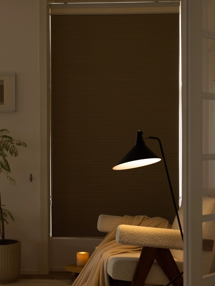Cordless day and night blinds in a cozy bedroom setting with soft lighting.