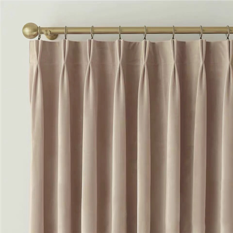 Luxurious soft sheen velvet drapes in rich colors enhancing living room and bedroom decor