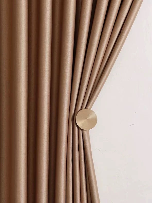 Luxury silk curtains in smooth draping, showcasing elegant beige color with sheen finish.