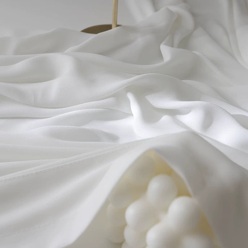 Soft white French door curtains with a flowing rod pocket design.