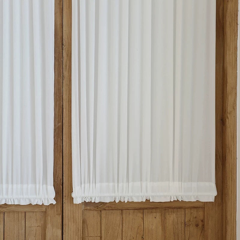 Custom rod pocket French door curtains providing privacy and elegant style.