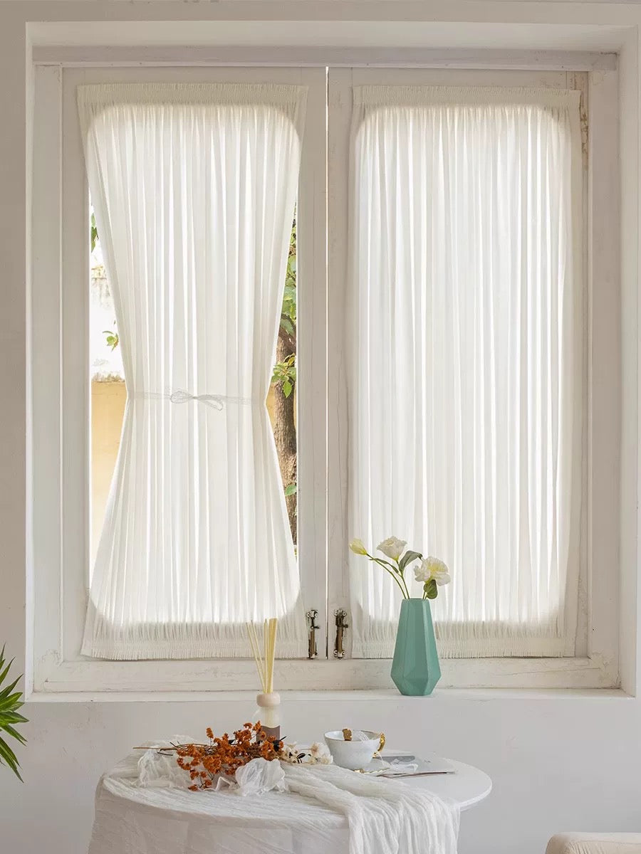Custom rod pocket French door curtains providing privacy and elegance with sheer fabric in a bright interior.