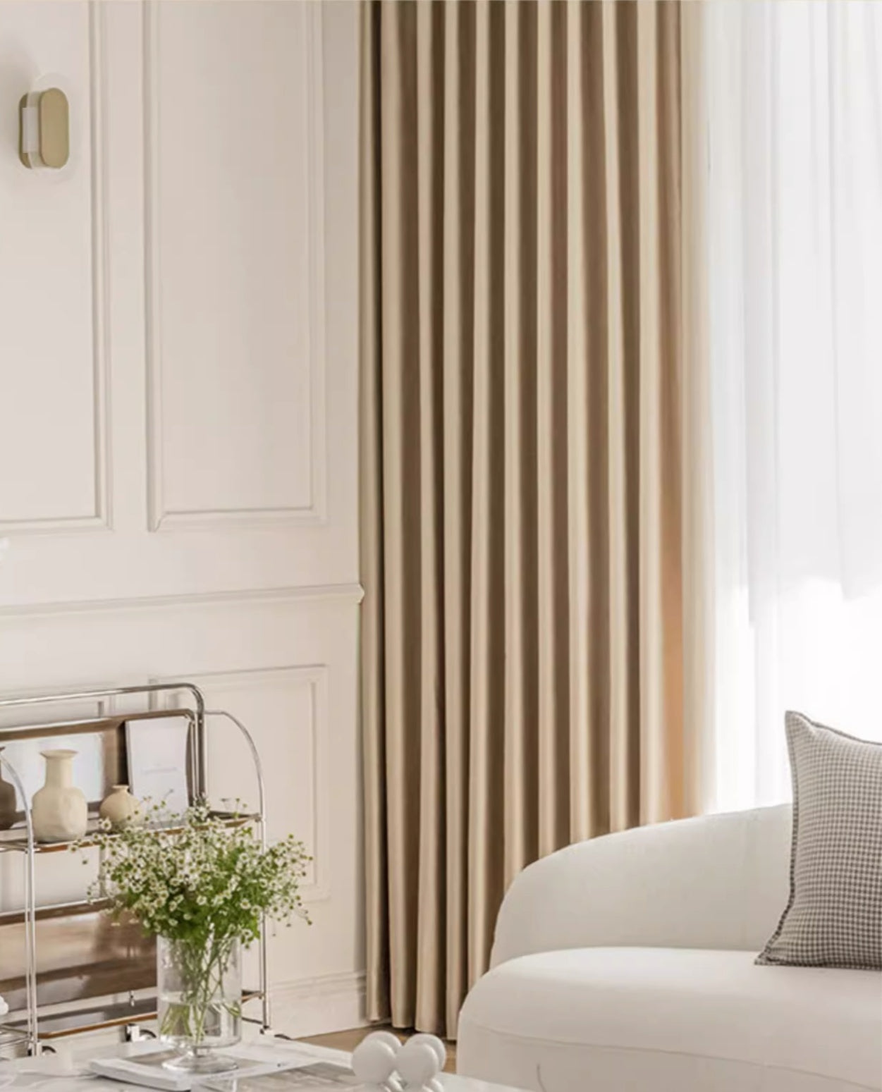 Elegant silk curtains in a living room, showcasing smooth draping and luxurious texture.