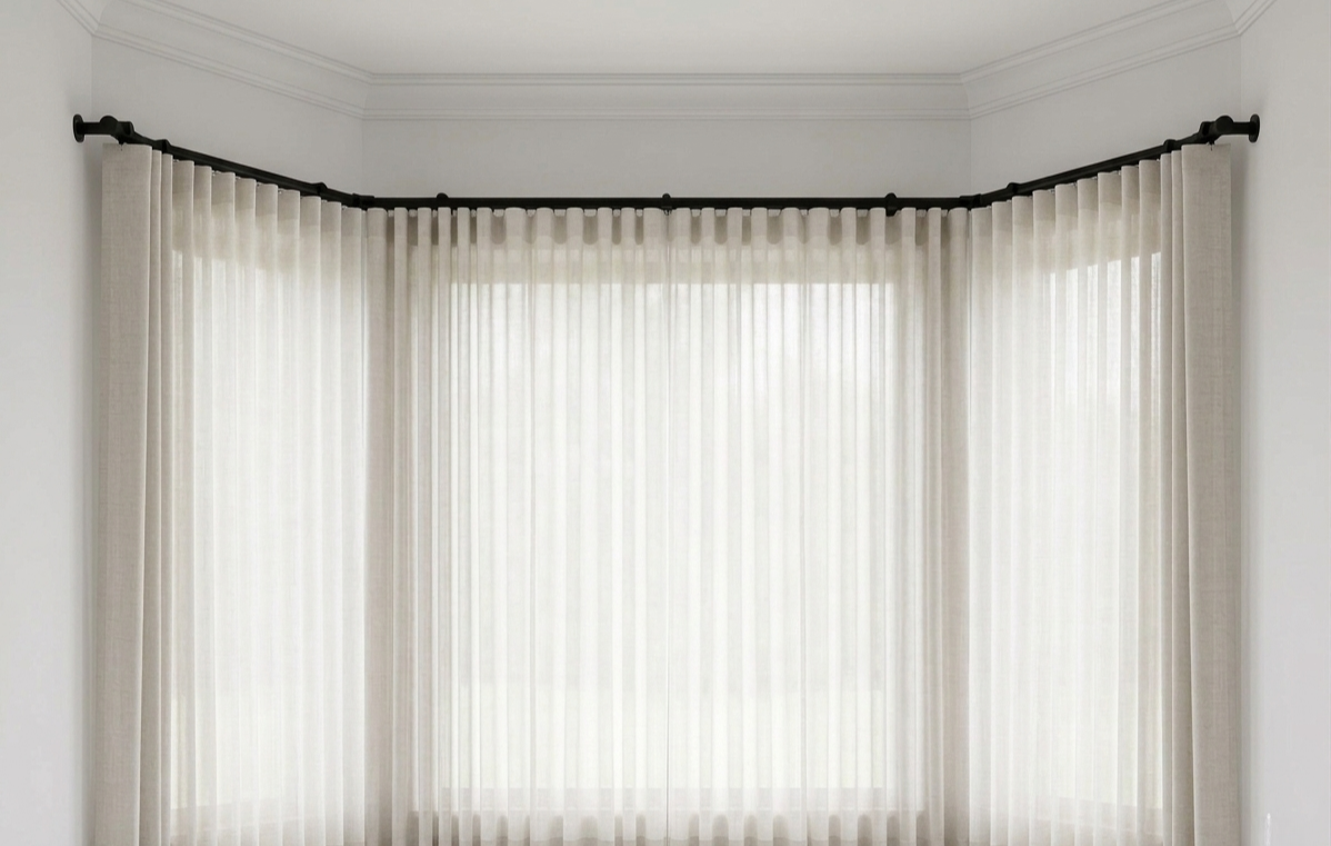 Heavy-duty custom bay window curtain rod with smooth gliding track for pleated and ripple fold curtains