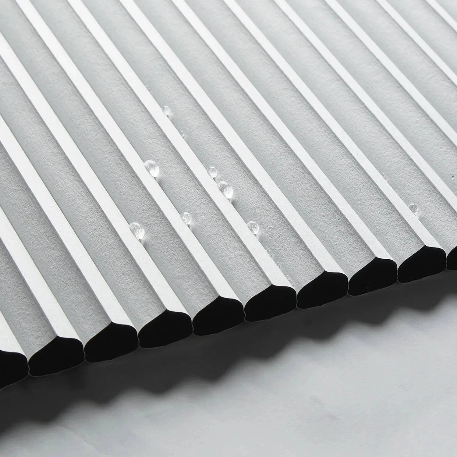 Affordable waterproof bathroom blinds with cordless honeycomb shades in five colors.