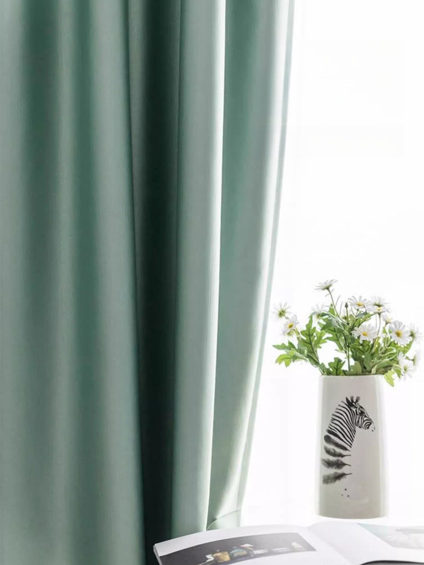 Elegant silk curtains with smooth draping in soft green, featuring easy maintenance and luxurious sheen.