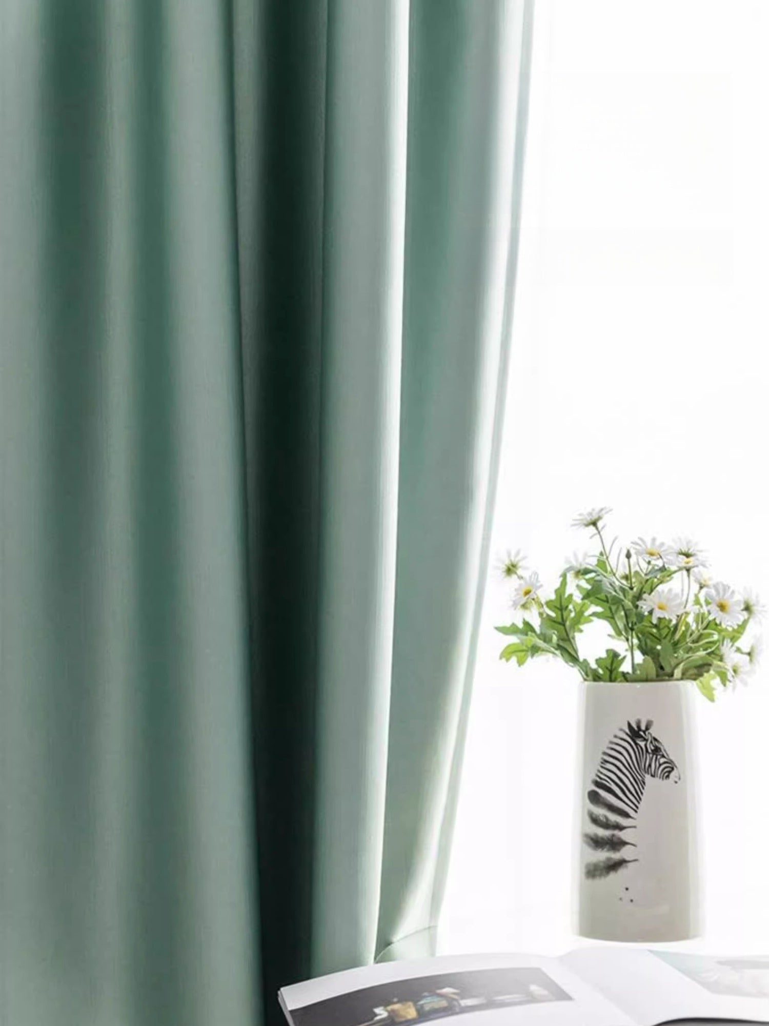 Elegant silk curtains with smooth draping in soft green, featuring easy maintenance and luxurious sheen.
