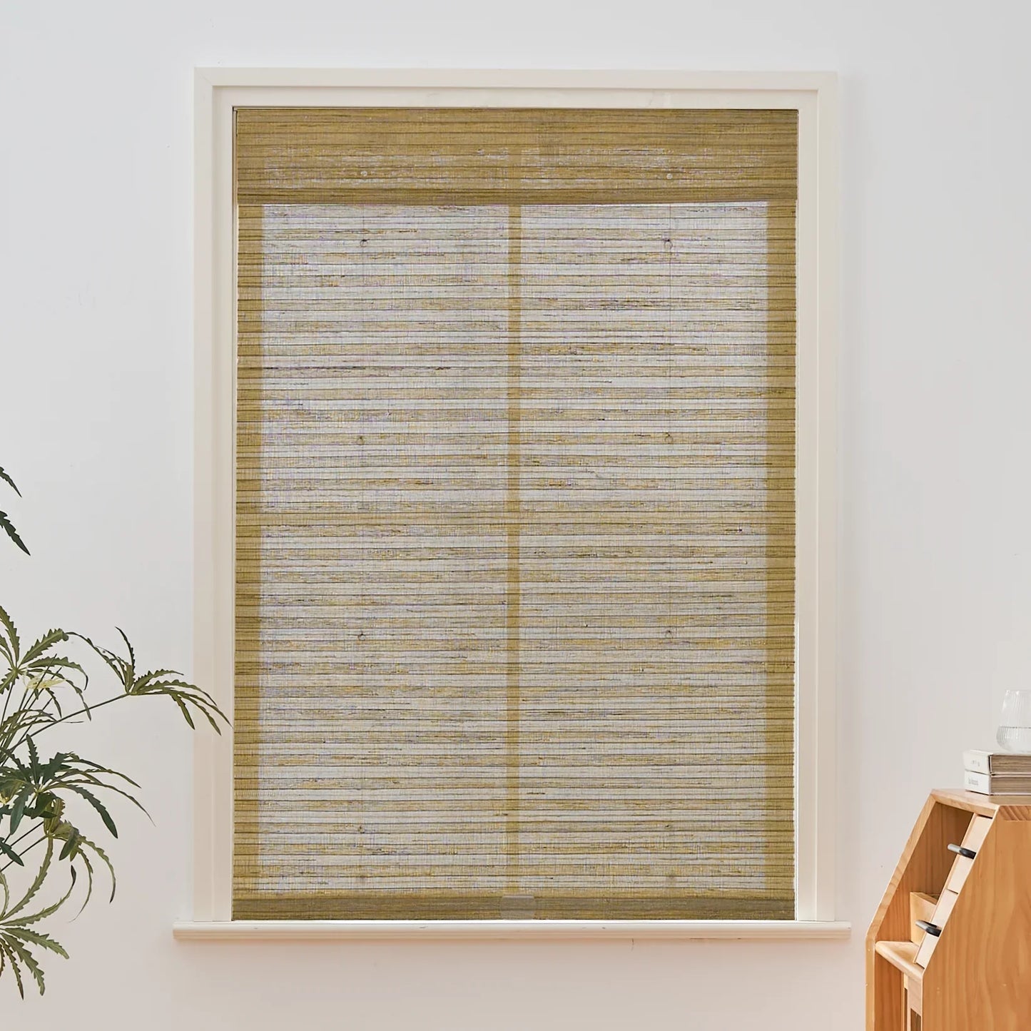 Natural hemp outdoor bamboo shades in beige brown with Roman design in window setting.
