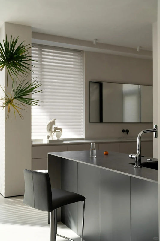 Shangri-La sheer shades adjusting light in a minimalist modern kitchen