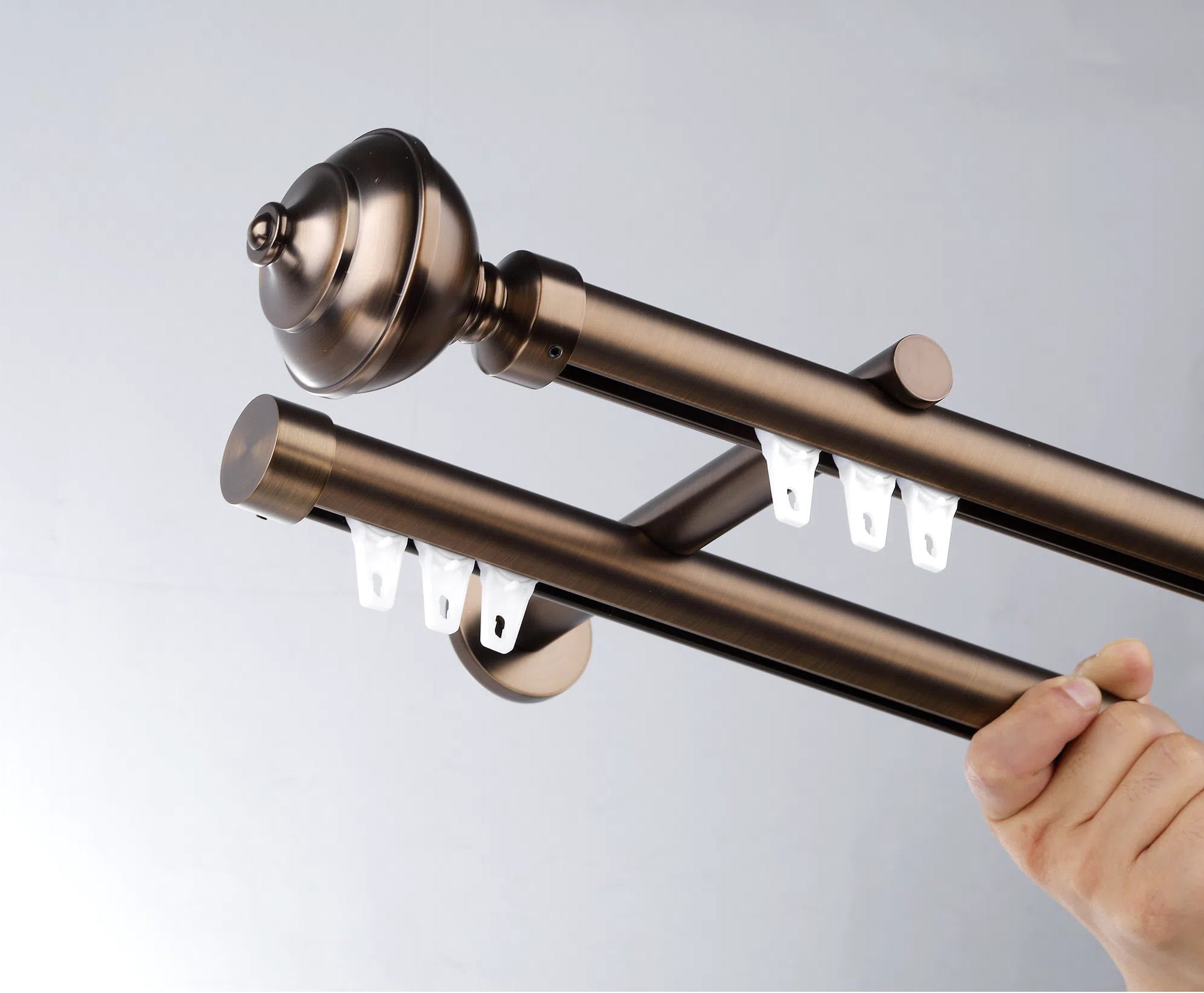 Antique bronze high end curtain rods with smooth-glide track, ideal for ripple fold and pleated drapes.