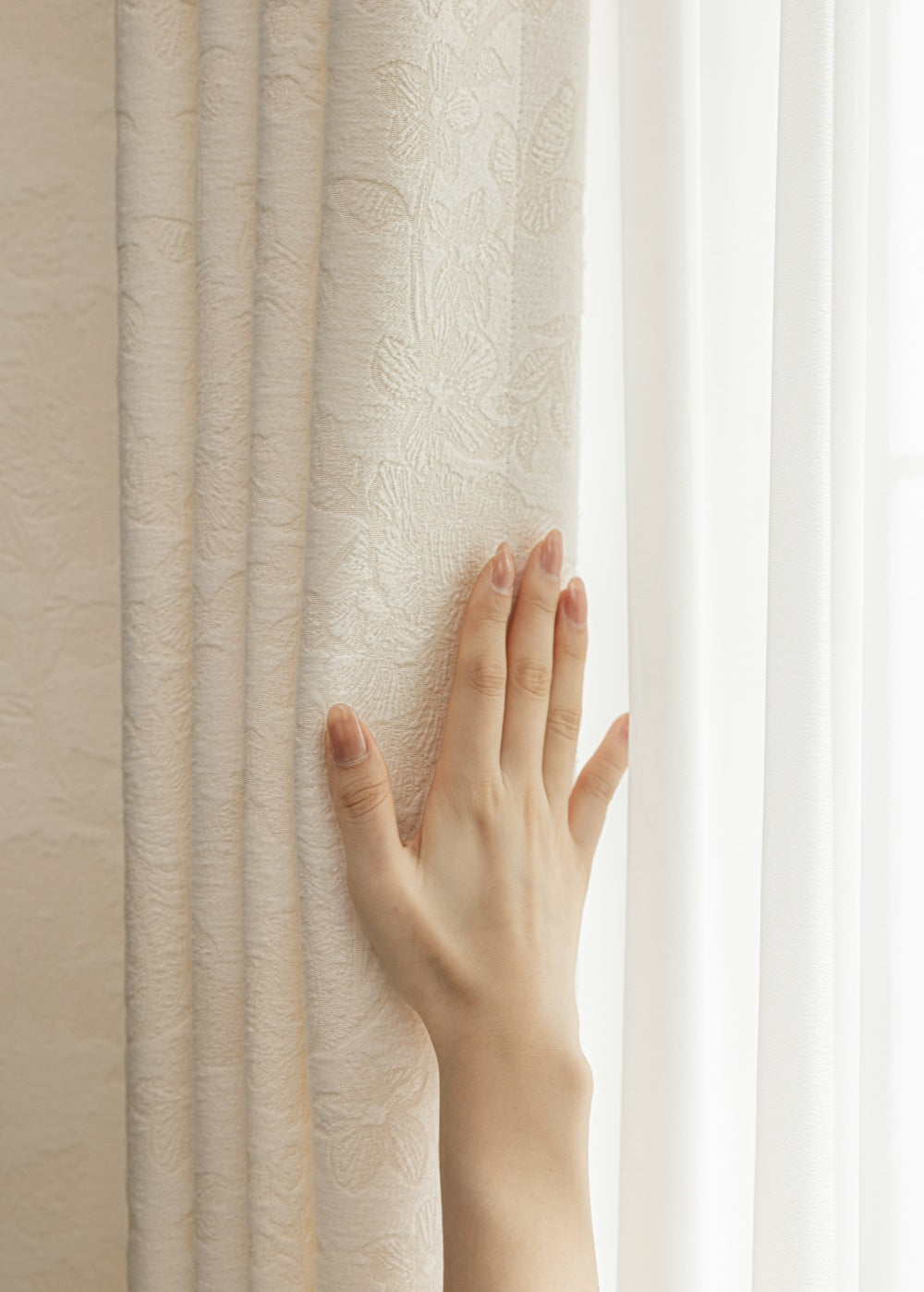 French-inspired embossed white blackout curtains with refined luxury pattern.