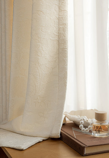 French embossed white blackout curtains with intricate details, perfect for enhancing modern living room décor.