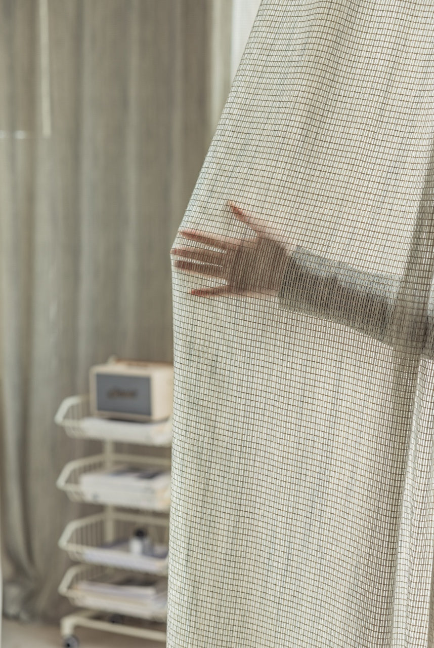 Smoky green net curtains with grid pattern, designer sheer drapes, elegant and versatile.