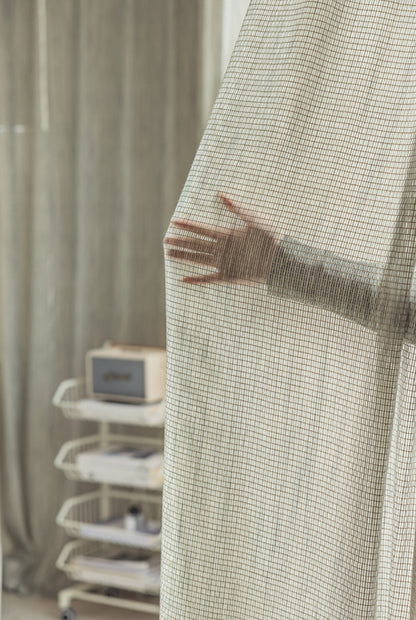 Smoky green net curtains with grid pattern, designer sheer drapes, elegant and versatile.