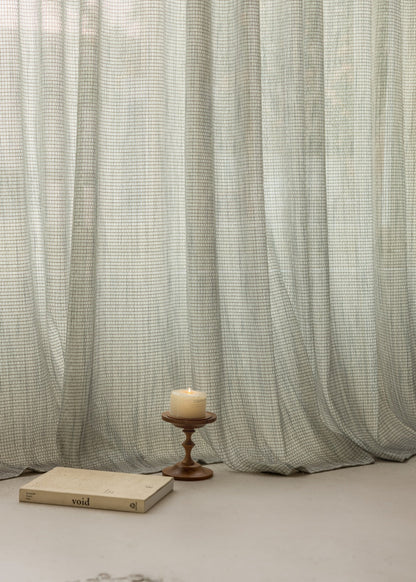 Smoky Green net curtains with grid pattern, subtle elegance, luxurious texture.