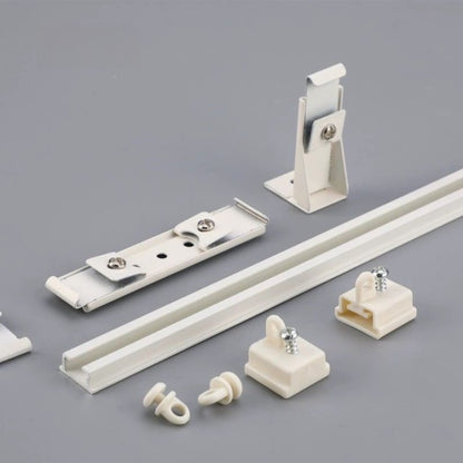 Various white plastic parts and hardware on a white background, including an ultra-thin silent invisible track made of premium aluminum alloy.