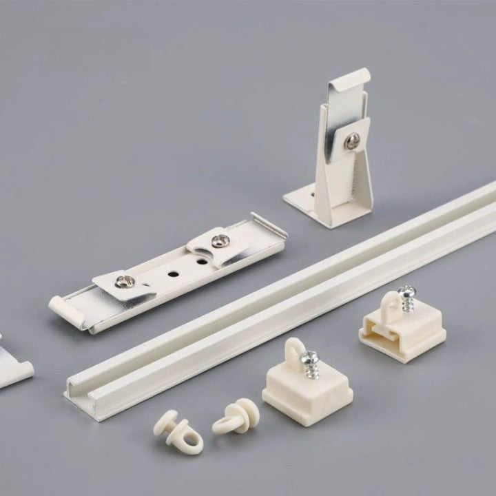 Various white plastic parts and hardware on a white background, including an ultra-thin silent invisible track made of premium aluminum alloy.