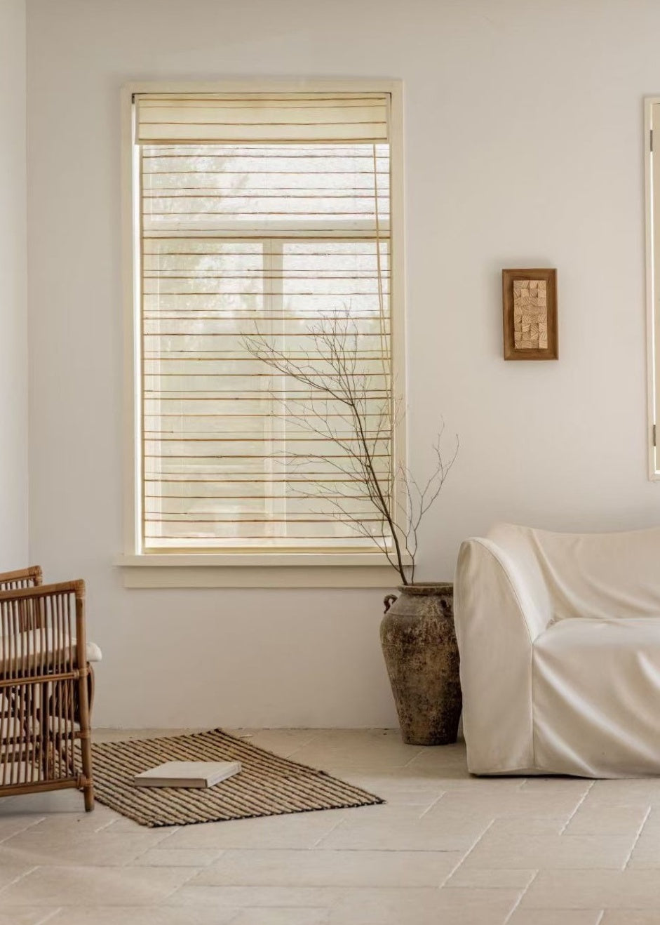 Natural ramie bamboo blinds in a minimalist room with neutral decor.