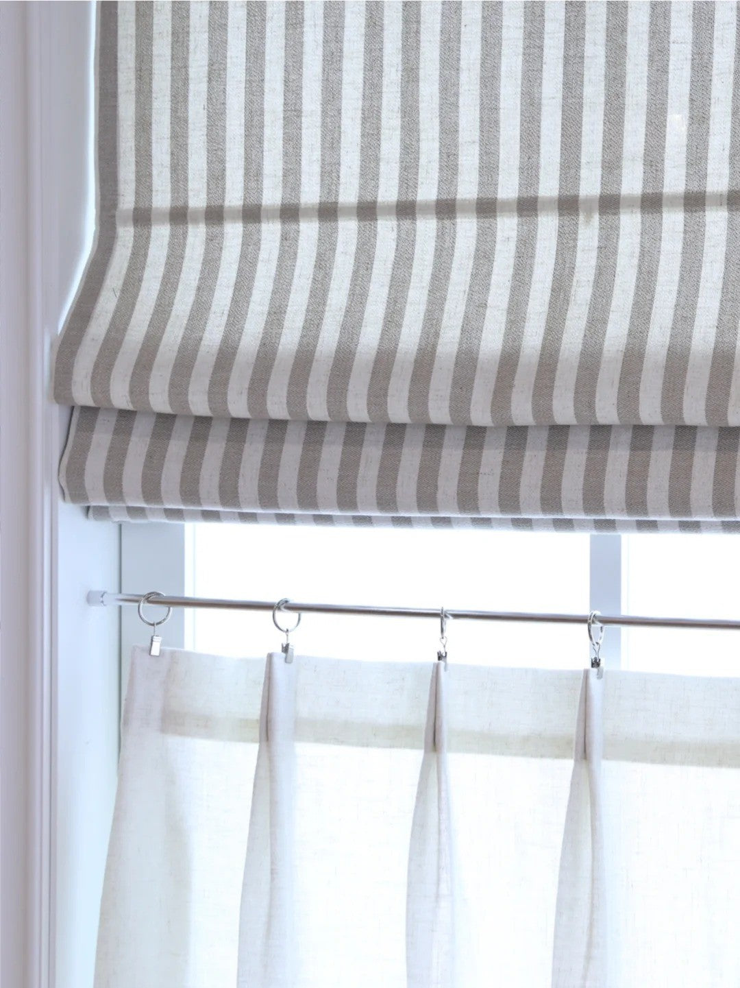 Striped Roman shades in light filtering fabric with cordless lift and modern design