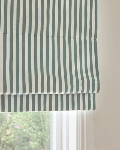 Custom striped roman shades with cordless lift, light filtering, and blackout options for child-safe window treatment