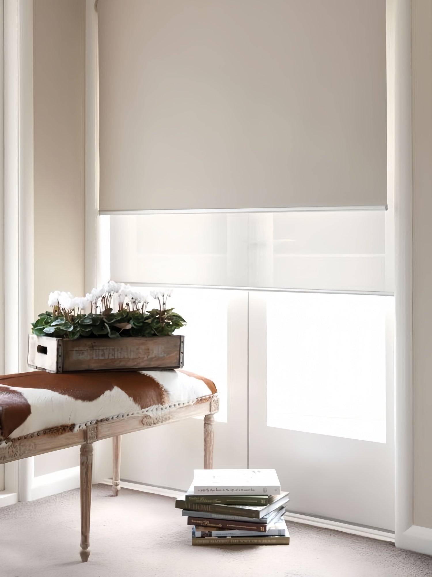 Double roller blinds with cordless dual roller system for bedroom light control, featuring sheer and blackout layers in slim headrail