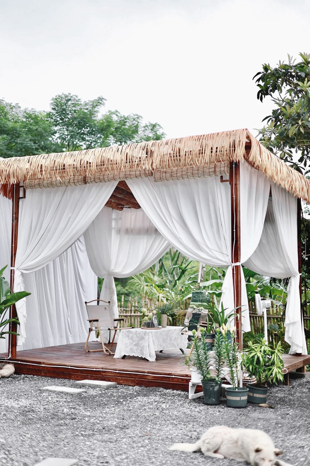 Outdoor curtains on a gazebo, UV-resistant and water-repellent, enhancing patio decor.