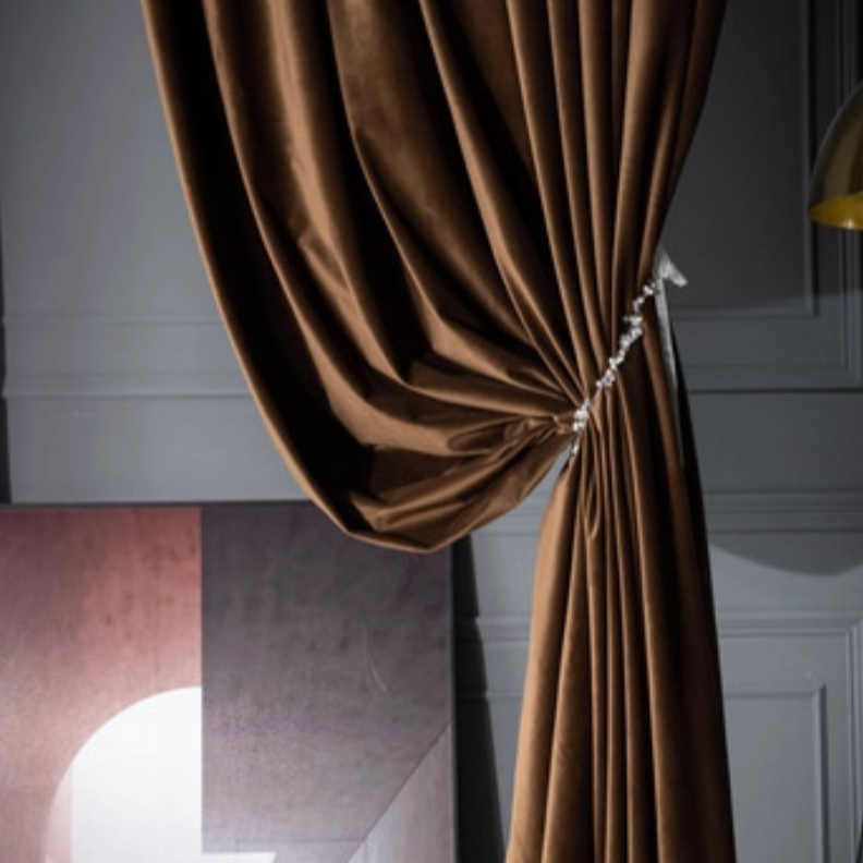 High-matte brown velvet drapes tied back in elegant living room setting