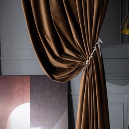 High-matte brown velvet drapes tied back in elegant living room setting