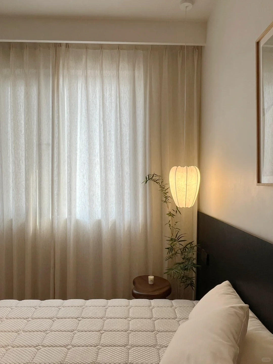 Luxurious linen-wool blend sheer curtain in a bedroom setting with soft ambient lighting and minimalist decor, enhancing privacy and natural light