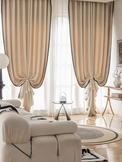 A cozy living room with a white couch, black and white rug, and elegant EaseEase Luxury Heavyweight Chenille Drapery Pleated for Bedroom.